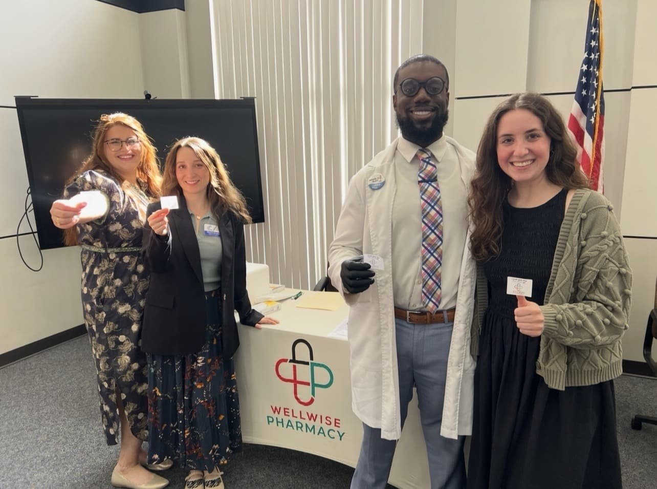 24 hour pharmacy exterior signage at night with lights on