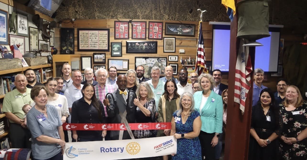 Friendly pharmacy team assisting customers at a 24 hour pharmacy counter